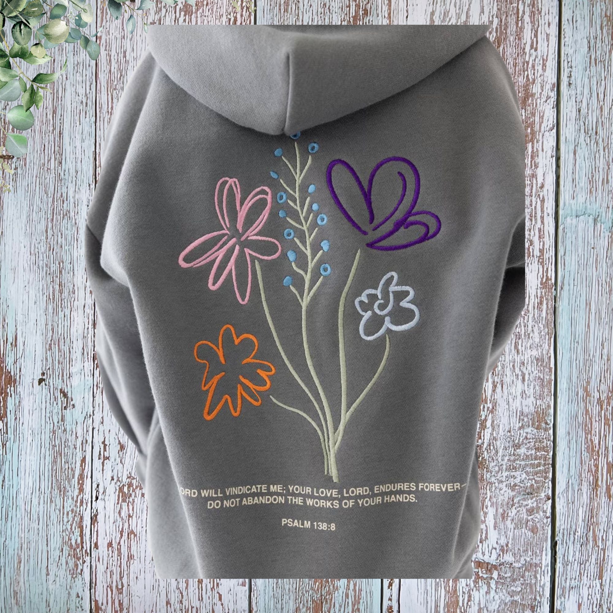 God's Working Children's Hoodie - back embroidery closeup with Psalm 138:8