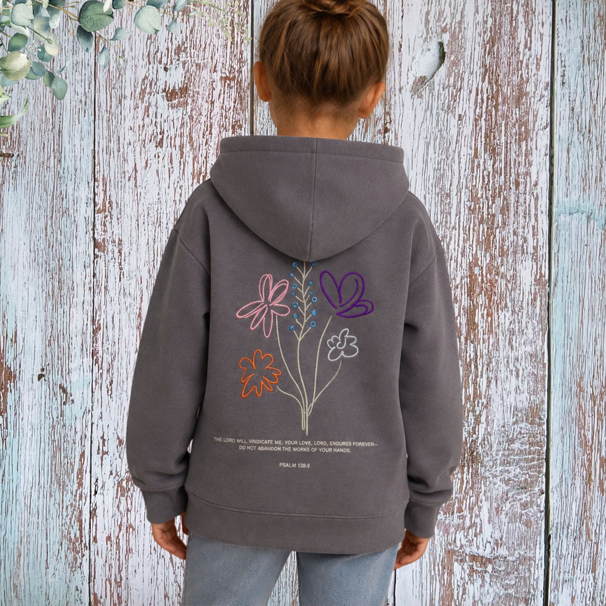 Girl wearing God's Working Children's Hoodie - back lifestyle photo
