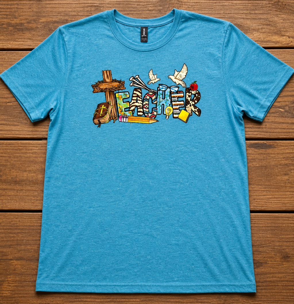 Christian Teacher T-Shirt in Heather Galapalos Blue— faith-inspired teacher graphic with cross, Bible, and dove by Pressed in Faith by Anna"