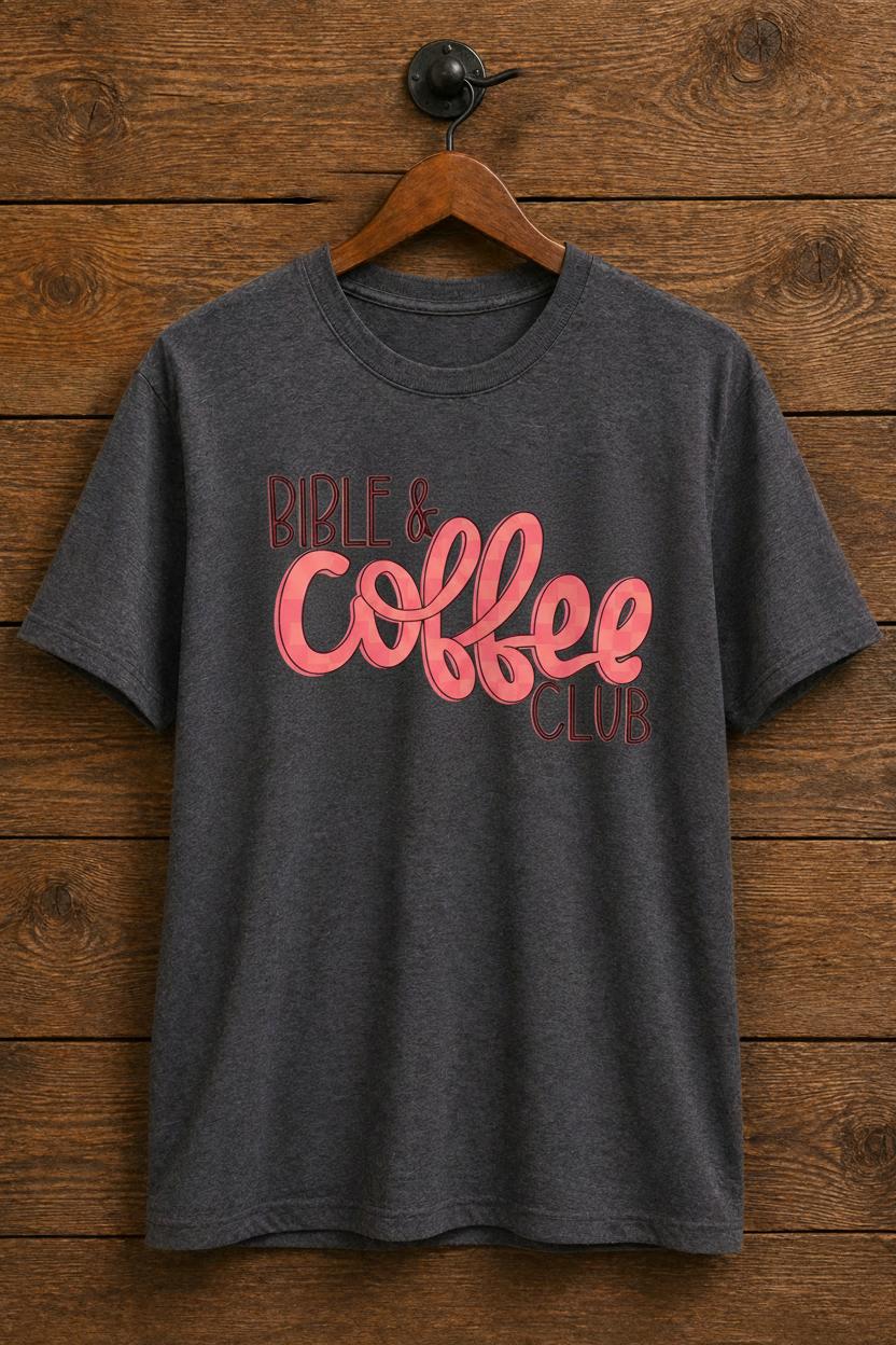 "Bible & Coffee Club Christian t-shirt in Heather Dark Grey — bold coral script graphic by Pressed in Faith by Anna"