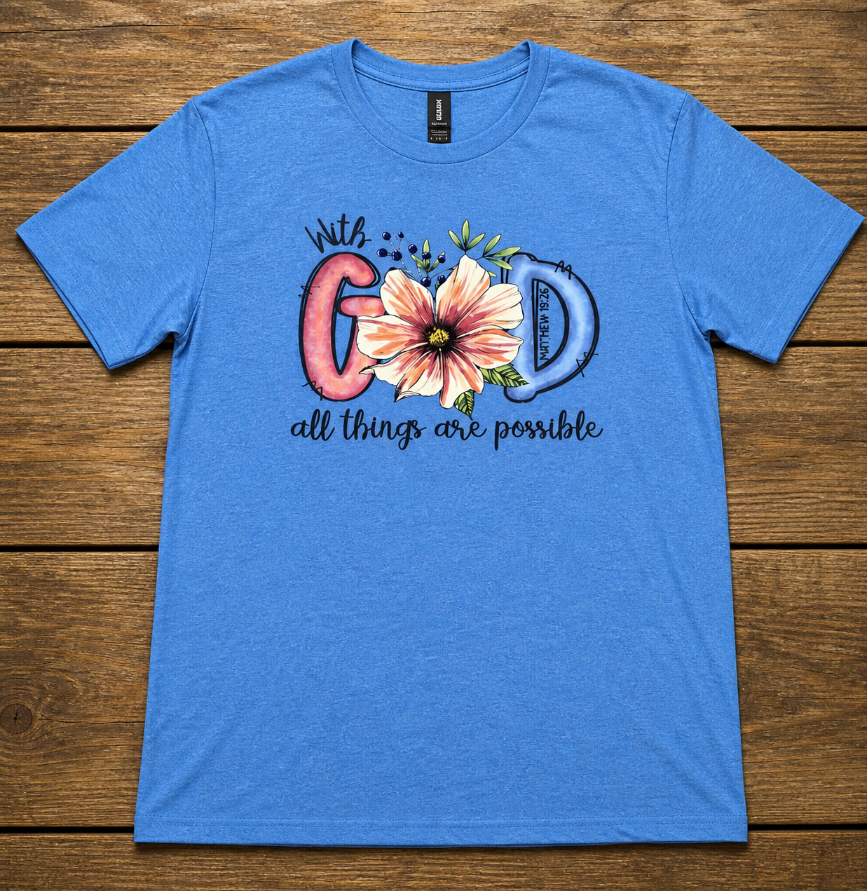 "With God All Things Are Possible Christian t-shirt in Blue — watercolor floral Matthew 19:26 graphic by Pressed in Faith by Anna"