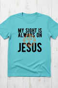  "My Sight Is Always On Jesus Christian t-shirt in Heather Galapagos Blue — bold cross-scope graphic by Pressed in Faith by Anna"