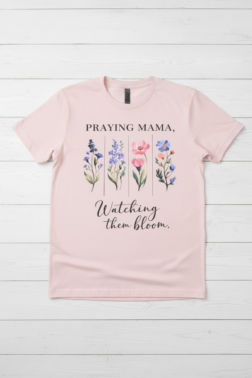 "Praying Mama Watching Them Bloom Christian t-shirt in Light Pink  — watercolor wildflower graphic by Pressed in Faith by Anna"