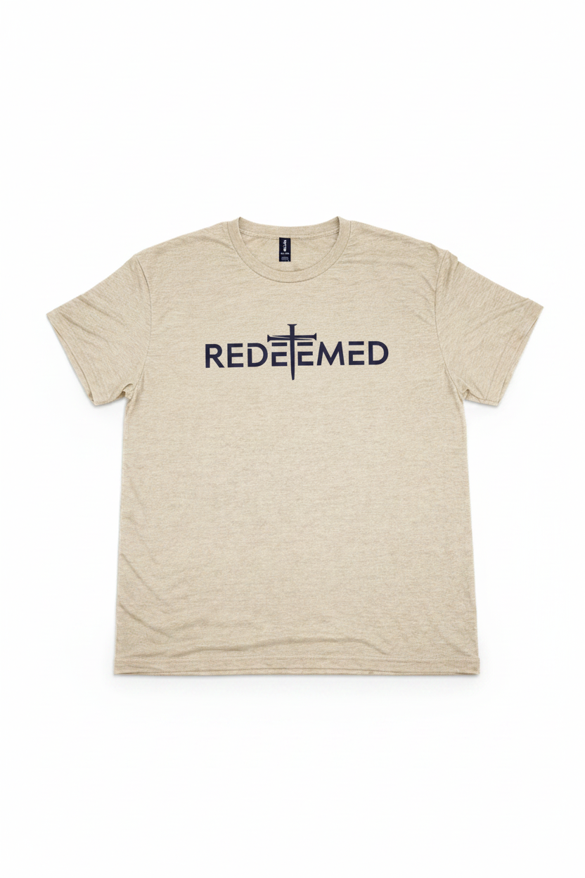 "Redeemed Cross Christian t-shirt in Heather Oatmeal — bold minimalist REDEEMED cross graphic by Pressed in Faith by Anna"